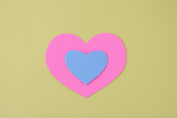 Multicolored Valentine Cards in the shape of a Heart on Light Background